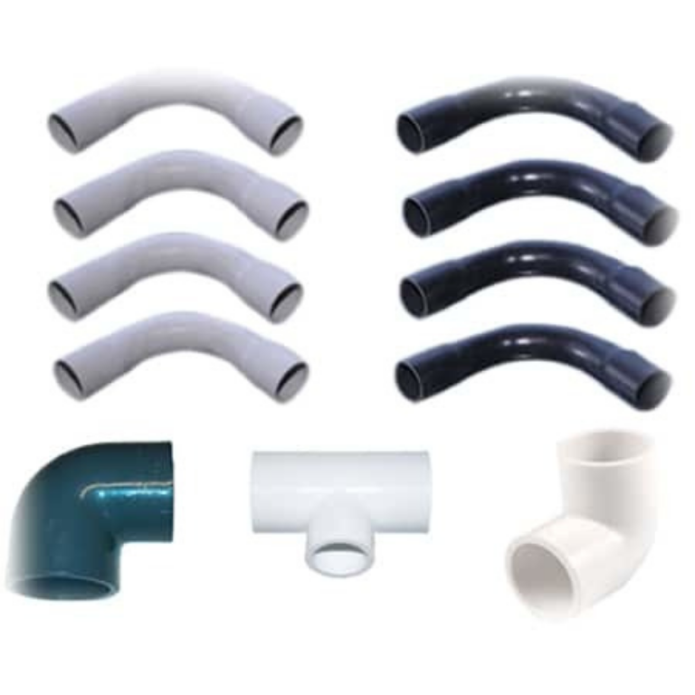 White and black electrical pipe fittings including bends and tees