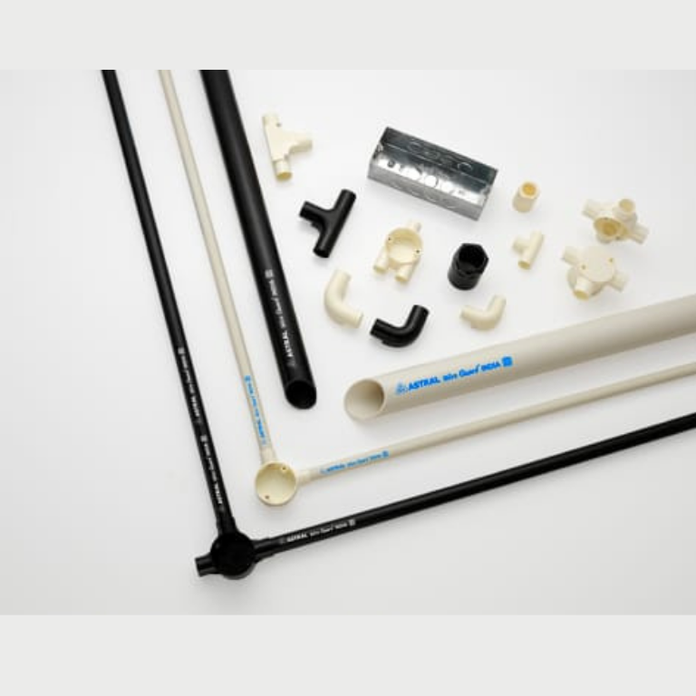 Conduit pipes with wiring accessories on white background